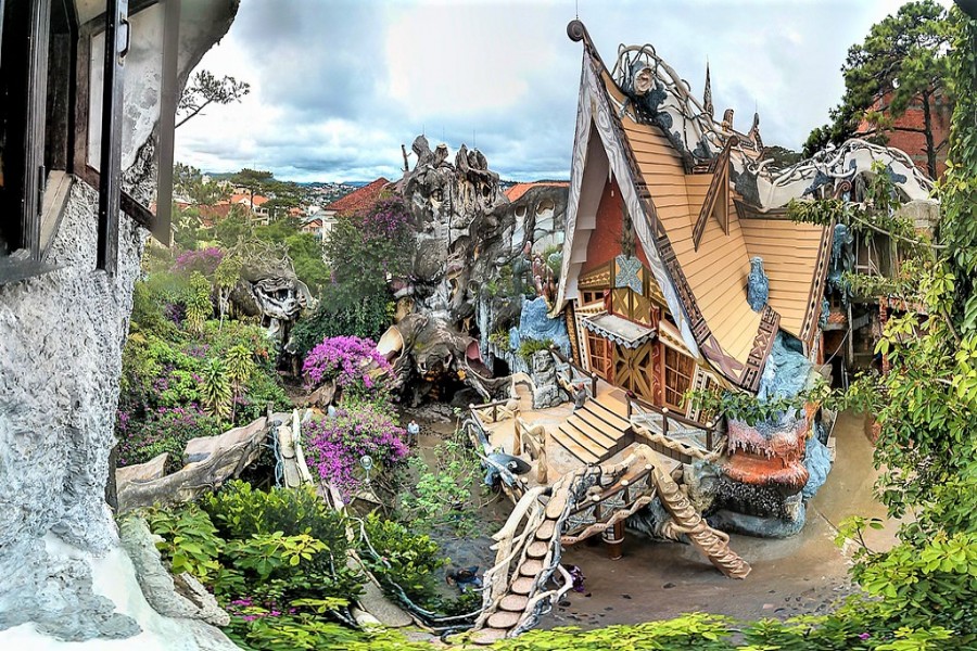 Surreal architecture with winding staircases and root-like forms