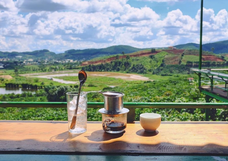 Vietnamese drip coffee on background of Dalat farms