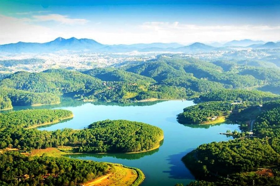 Calm lake surrounded by hills and forest